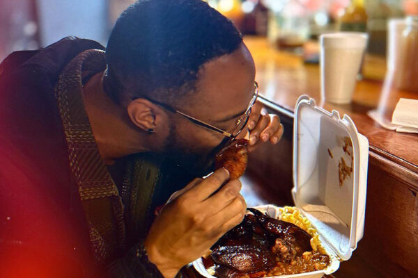 A patron enjoys BBQ at GA Boy BBQ - 1976 Hosea L Williams Dr NE, Atlanta, GA 30317