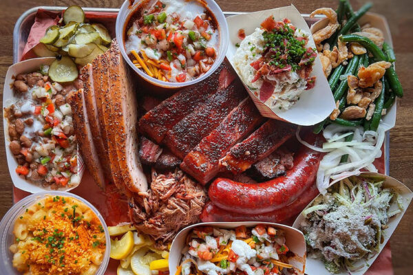 A full spread of food from Fox Bros BBQ.