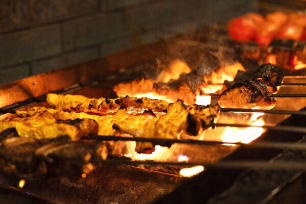 Kabobs on the grill at Rumi's Kitchen.