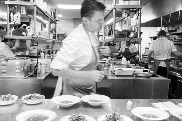 Kitchen behind the scenes in black and white at The Chastain.